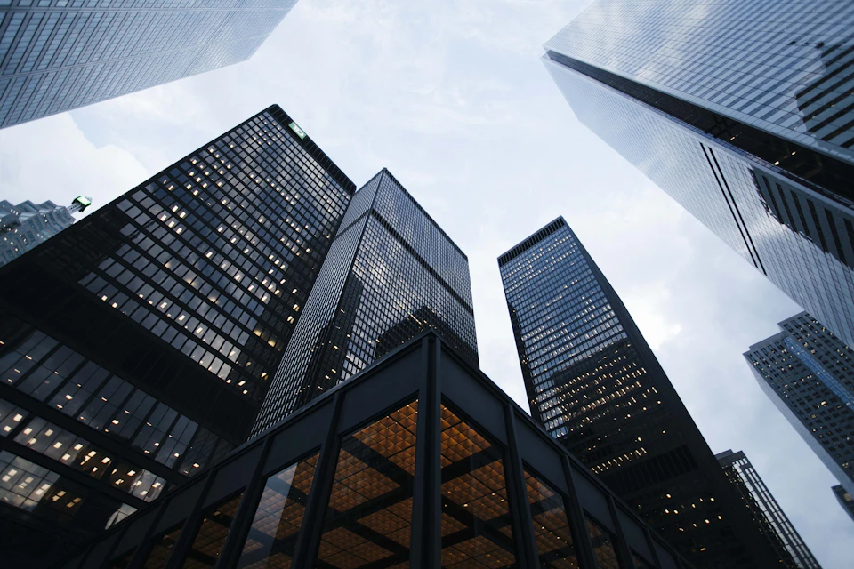 Architectural lines of glass office towers viewed from below